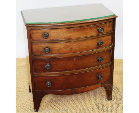 A George III style mahogany bow front chest, of small proportions, with four graduated long drawers, on bracket feet, 70cm H 