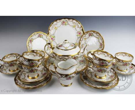 A Salisbury China 'Chelsea' pattern tea service, with floral decoration and gilt borders, comprising; six tea cups, six sauce