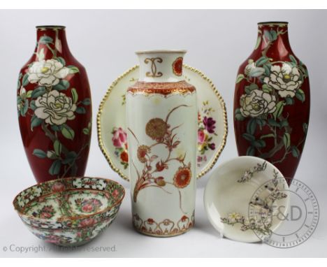 A pair of Japanese cloisonne vases, each decorated with white peony's against a red ground, with character mark to base, 31,5