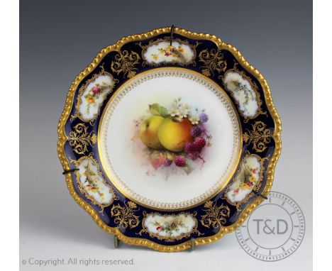 A Royal Worcester fruit painted plate by G H Cole, with apples, blackberries and blossom within a cobalt and gilt rim, puce p