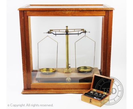 A set of Victor micro scales, in walnut case, with apart set of weights, the box with label for J.W. Towers& Co, and an embos
