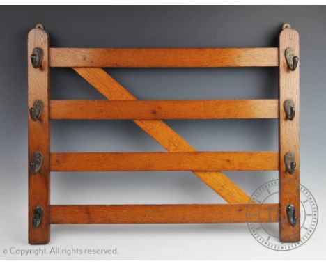 An Edwardian oak novelty coat rack modelled as a country gate, set with eight brass hooks, 49cm x 61.5cm CONDITION REPORT: Th