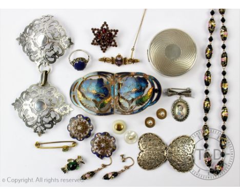A collection of silver and jewellery, to include; an amethyst set bar brooch, buckles including silver and enamelled examples
