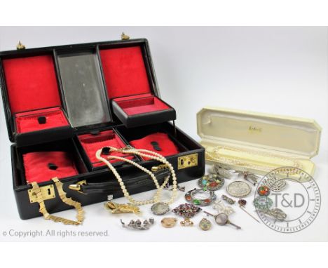 A selection of mixed costume jewellery to a jewellery box, to include; a rose enamelled oval locket, a gold plated circular l