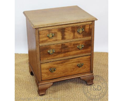 A George III style walnut bedside chest, with three long drawers, on bracket feet, 72cm H x 55cm W x 38cm D, with another sim