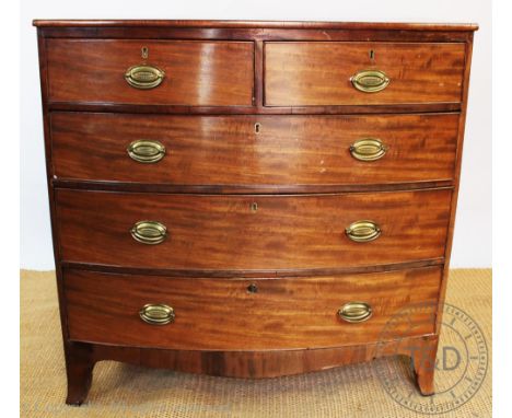 A Regency mahogany bow front chest of two short and three long drawers on bracket feet, 102cm H x 106cm W x 52cm D