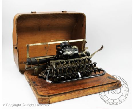 An American Blickensderfer typewriter, No 7, in oak veneered case, 34cm wide