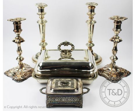 A collection of silver plated wares to include, two pairs of silver plate on copper candle sticks, a sardine dish and cover a