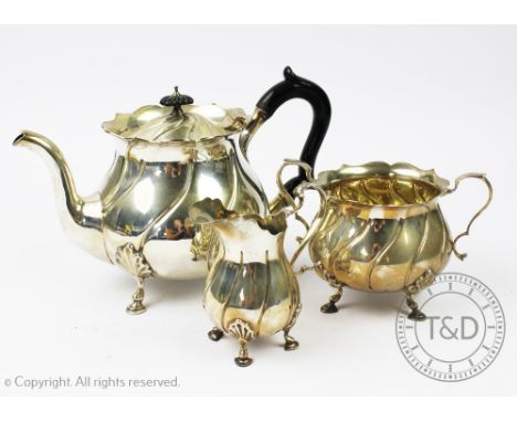 A late Victorian three piece silver tea service, Goldsmiths and Silversmiths Company Limited, London 1900, each piece of wryt