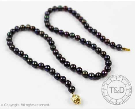 A single strand uniform 'Tahitian' pearl necklace, with attached spherical clasp stamped '375', each pearl of approx 6mm diam