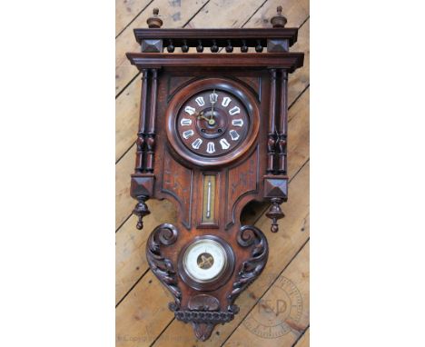 A Continental carved and stained beech wall clock, c1900, the dial signed 'Giraud 7 Rue D'Amsterdam Paris', with enamel Roman