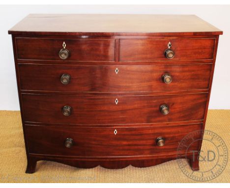 A Regency mahogany bow front chest, of two short and three long drawers, on splayed bracket feet, 96cm H x 117cm W x 56cm D C