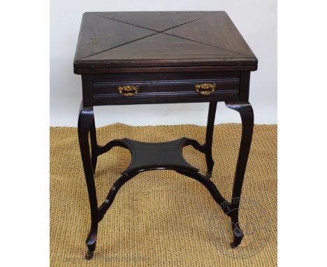 An Edwardian mahogany envelope top card table with drawer upon cabriole legs, 74cm x 55cm 