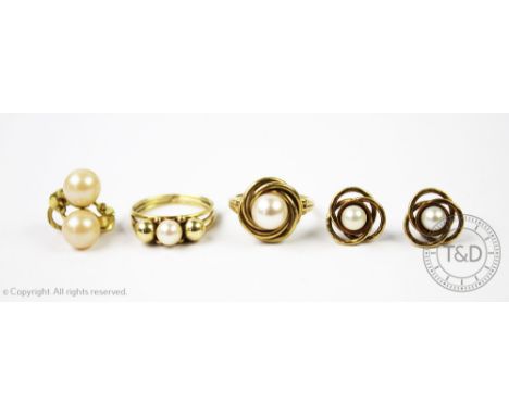An untested pearl set ring within rope twist design surround stamped '585', with a further 'pearl' set ring, unmarked and two