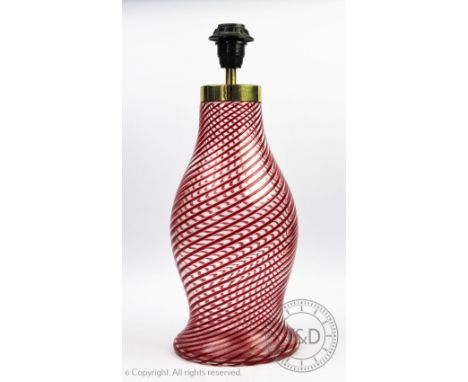 A Murano glass lamp, with spiral red and clear glass pattern, original label to side, 38cm high (size not including the bulb 