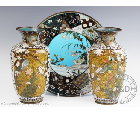 A pair of Japanese cloisonne vases, each depicting aquatic and garden birds to both sides within floral and foliate stylized 