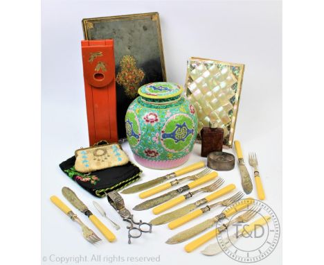 A selection of items to include a mother of pearl and abalone set folio, a set of six silver collared fish knives and forks, 