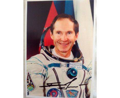 Cosmonaut Valery Tokarev signed colour portrait photo 4x6 inches. Nice pose in white space suit of the veteran astronaut. Rus