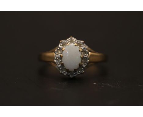 Ladies 9ct Gold Opal and stone set cluster ring Size L. 2g total weight 