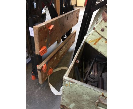 A GREEN CHEST OF TOOLS AND A WORK BENCH