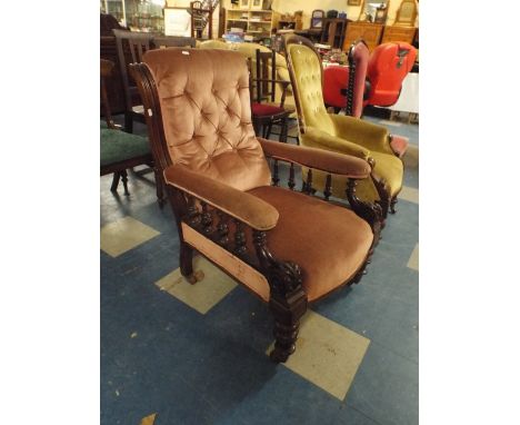 A Late Victorian Mahogany Farmed Arm Chair with Spindle Supports and Button Cushion Back  