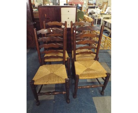 A Set of Four Rush Seated Oak Framed Ladder Back Chairs