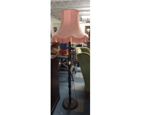 A Turned Wooden Standard Lamp and Shade