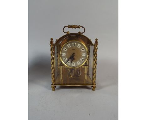 A Brass Carriage Clock by Koma, 17cm high