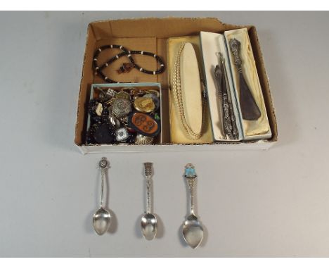 A Tray of Curios to Include Costume Jewellery, Teaspoons, Silver Handled Button Hooks and Shoe Horns