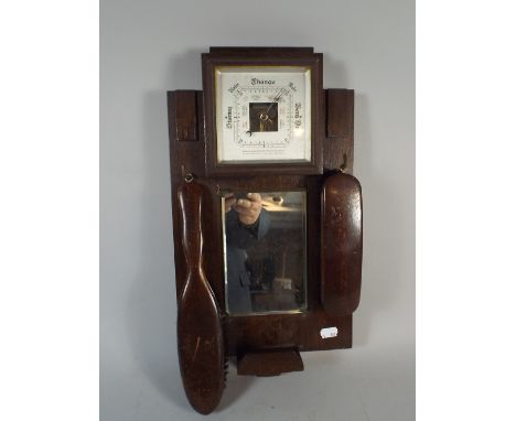 An Edwardian Oak Wall Hanging Wall Barometer with Mirror and Clothes Brushes 