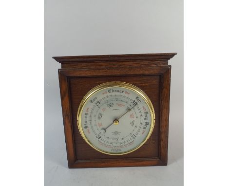 An Oak Framed Wall Hanging Aneroid Barometer  