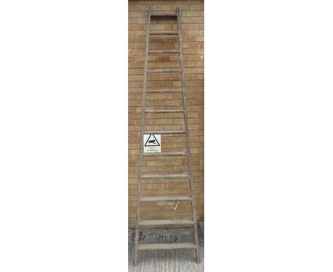A 12-rung mid-20th century tapering wooden ladder (3m high)