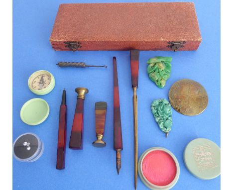 A polished hardstone-style handled desk set comprising two unengraved seals, a letter opener, a fountain pen and a propelling