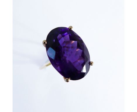 A 10-carat gold ring set with a large amethyst, ring size J/K (boxed)
