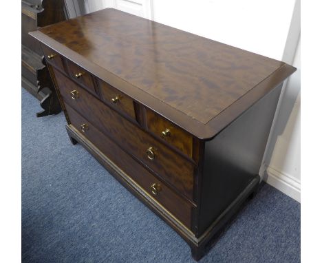 A Stag Minstrel mahogany chest: moulded top above four quarter-width drawers, two full-width drawers below, shaped apron and 