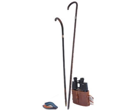 An interesting assortment to include a 19th century silver-mounted Malacca walking cane; one other ebonised example with a si