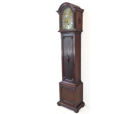 An oak-cased longcase clock: the 10.5 inch broken arch brass dial signed 'F A Chandler, Leamington' and with silvered chapter