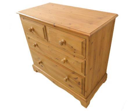 A modern pine chest in 19th century style: thumbnail moulded top above two half-width and two full-width graduated drawers, s