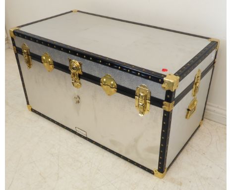 A silver-coloured metal-mounted storage trunk (97cm wide x 62cm deep x 56cm high)