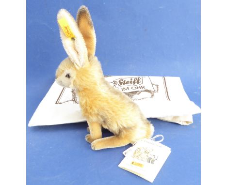 A&nbsp;mohair&nbsp;Steiff hare: seated upright, with&nbsp;usual button in ear and with original accompanying tickets and Stei