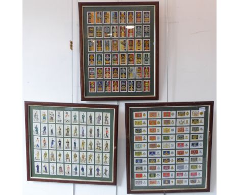 Cigarette cards: three framed and glazed sets:John Player & Sons, 'Uniforms of the Territorial Army' (50) and 'Drum Banners &