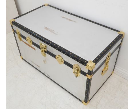 A silver-coloured metal-mounted storage trunk (97cm wide x 62cm deep x 56cm high)