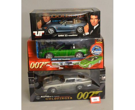 Three James Bond 1:18 scale diecast model cars: AutoArt Goldfinger Aston Martin DB5; UT Models BMW Z3; Joyride Die Another Da