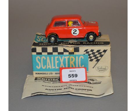 Scalextric C76 Mini Cooper in red with tan interior and racing number 2. G+ in G box with instruction leaflet.