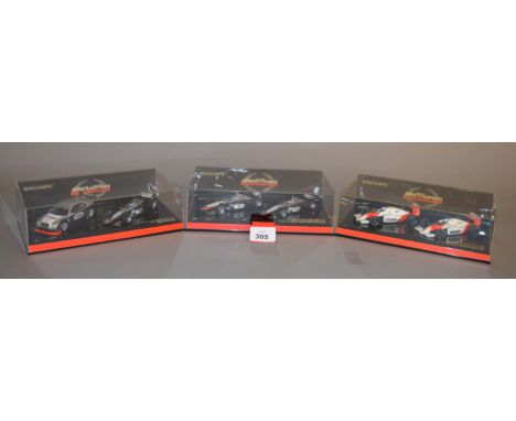 Minichamps. Three boxed McLaren Racing Car Sets, each containing two diecast models in 1:43 scale, World Champion Set Edition