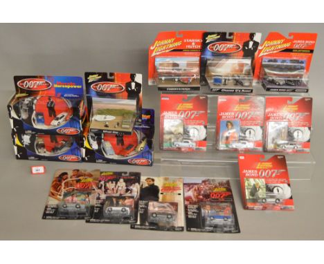 A quantity of Johnny Lightning James Bond 007 diecast models in 1:64 scale, including eight individually carded models, three