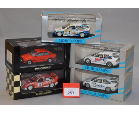 Minichamps. Three Ford Escort Cosworth diecast model cars in 1:43 scale, together with a 1981 Fird Escort III in red and 430 