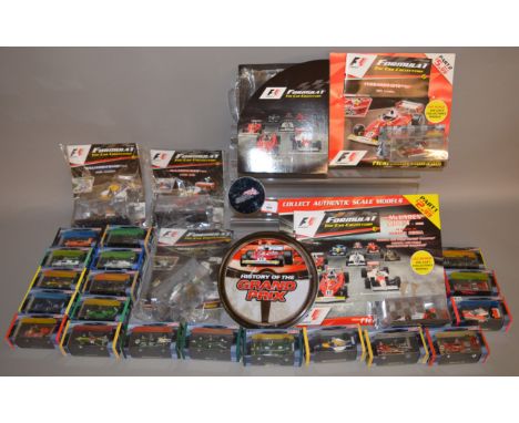 Nineteen boxed Atlas diecast Racing Car models from their 'Grand Prix Legends of Formula 1' series and five boxed 1:43 scale 