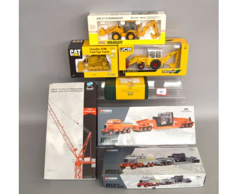 Four boxed diecast Construction vehicle models including a Joal JCB 217S Centremount, a Britains JCB 3C Mk III, an ERTL CAT  