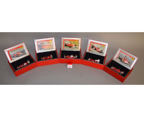 Five Hot Wheels diecast Ferrari models in 1:43 scale including a 1971 312B2, a 1974 312B3/74, a 1975 312T, a  1977 312 T2, to
